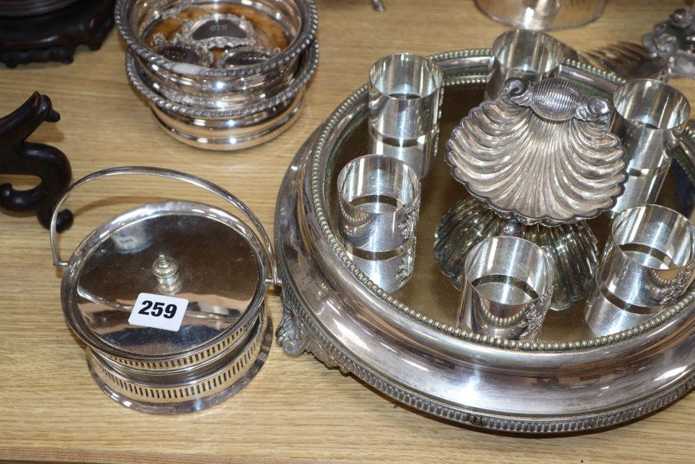 A plated cake stand, two pairs of coasters, a shell-shaped bon-bon stand, a cruet etc.